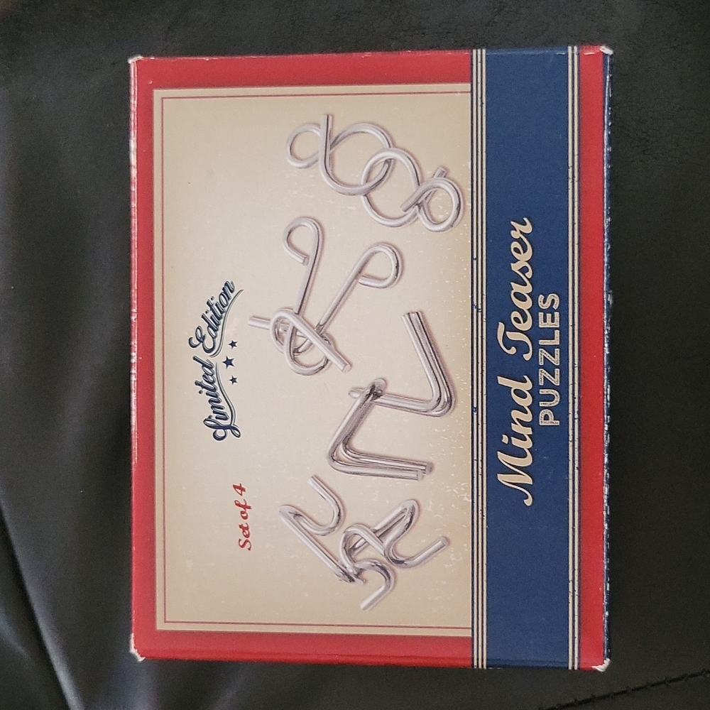 Take 50% off Set of 4 Metal Mind Teaser Puzzle